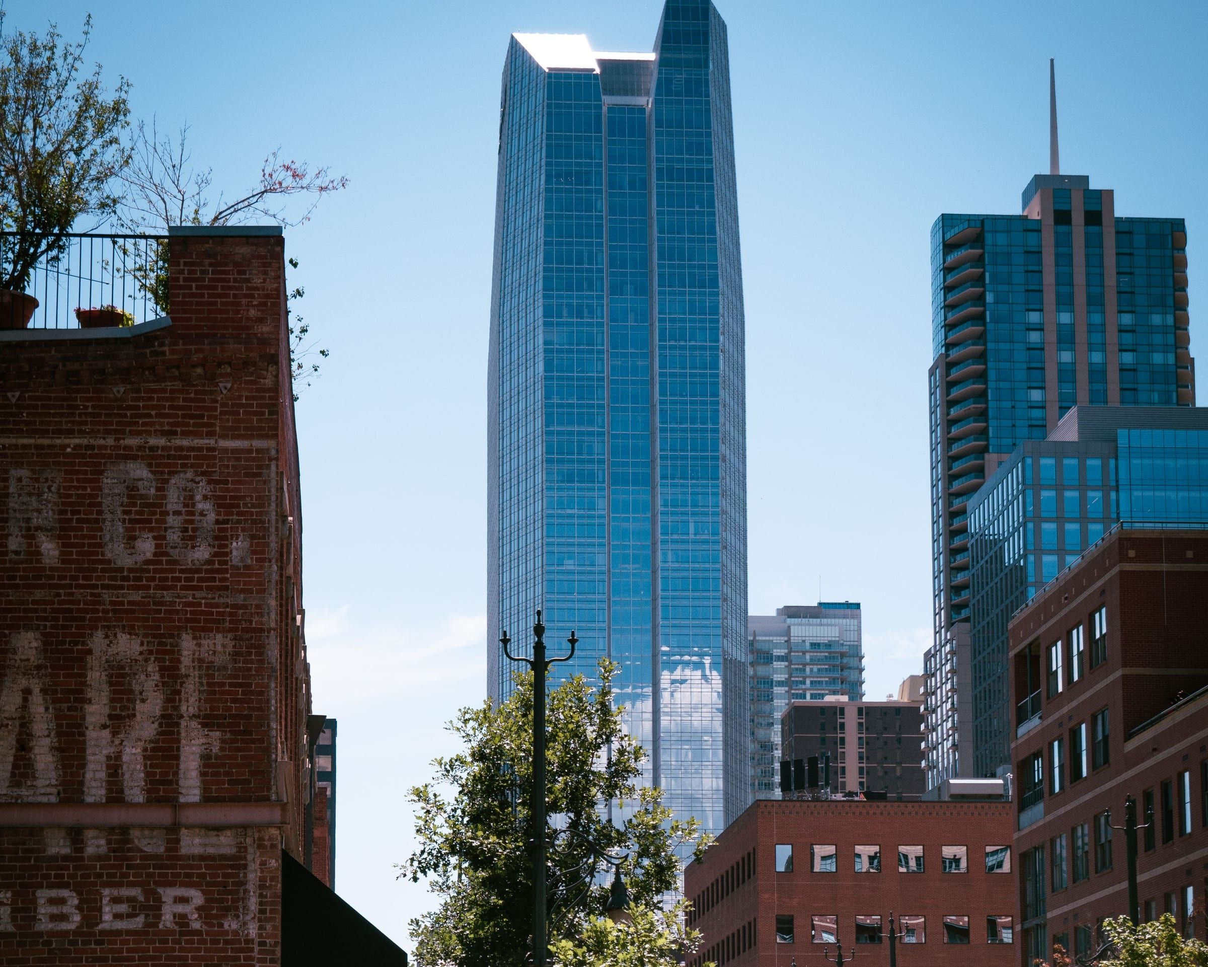 Devon Tower rising above the brick buildings of Bricktown in Oklahoma City